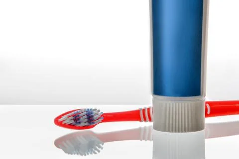 Tooth brush with paste isolated over white background 库存照片
