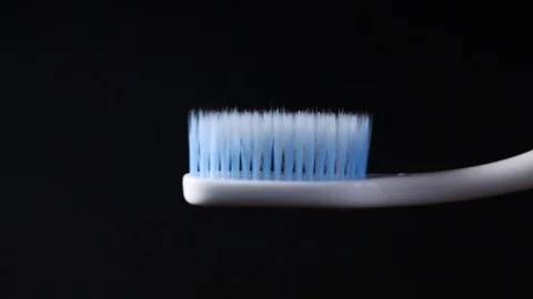 Tooth brush with tooth paste on black background Stock Footage 87399775