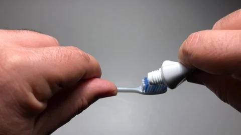 Tooth brush, toothpaste, hands Stock Footage 122105207