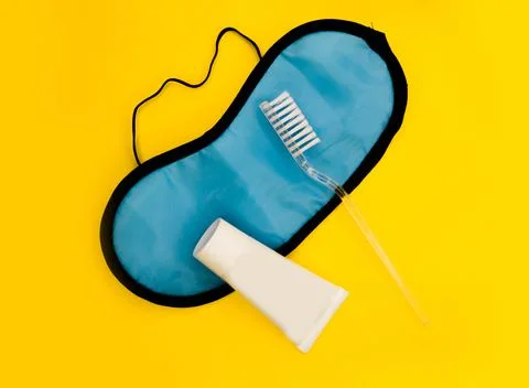 Tooth brush. Toothpaste. Mask for sleep. Getting ready for bed. Minimalistic Stock Photos