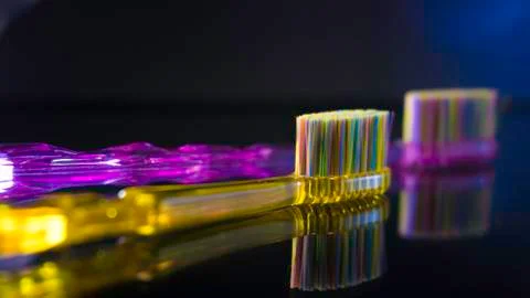 Tooth brushes  on dark background isolated Stock Photos