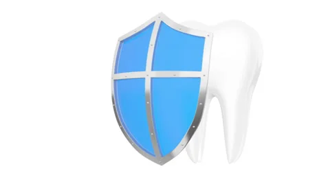 Tooth with metal shield on white background (Protection Concept) Stock Footage 39841987