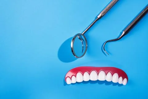 Tooth model with dental tool Stock Photos