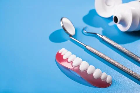 Tooth model with dental tool Stock Photos