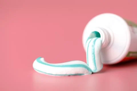 Tooth paste close up on pink background Stock Photos