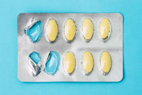 Toothache medication panel on blue background. Stock Photos