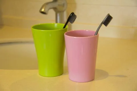 Toothbrush and cups Stock Photos