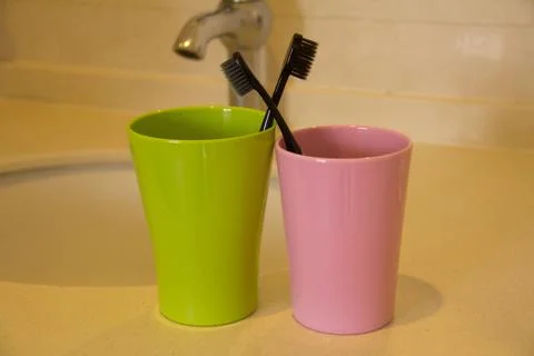 Toothbrush and cups Stock Photos