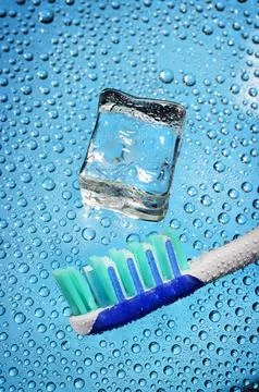 Toothbrush and ice cube Stock Photos