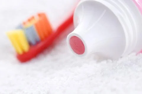 Toothbrush and strawberry tooth paste Stock Photos