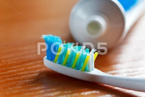 Toothbrush and toothpaste closeup Stock Photos