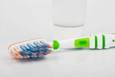 Toothbrush and toothpaste closeup on white background Stock Photos