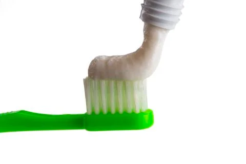 Toothbrush and toothpaste isolated on white background Stock Photos
