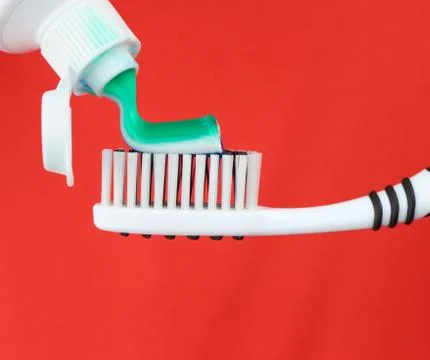 Toothbrush and toothpaste Stock Photos