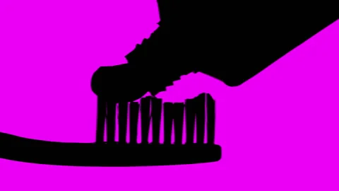 Toothbrush And Toothpaste (Silhouette With Magenta Background) Stock Footage
