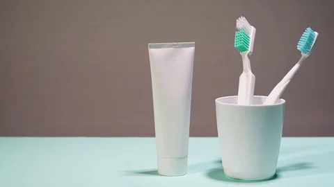 Toothbrush and toothpaste tube Stock Footage 81194672