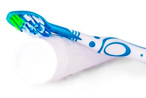 Toothbrush and toothpaste on white background. Stock Photos