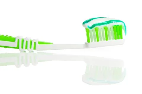 Toothbrush and toothpaste on white background Foto stock