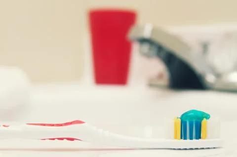 Toothbrush in bathroom Stock Photos