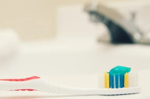Toothbrush in bathroom Stock Photos