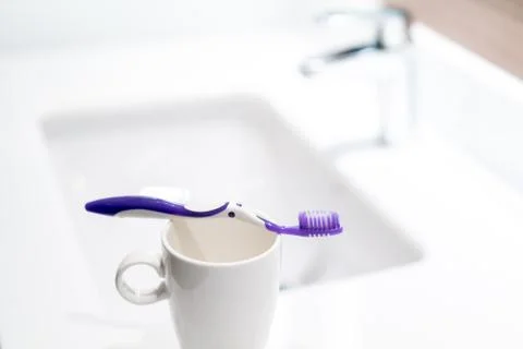 Toothbrush in the bathroom Stock Photos