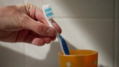 Toothbrush being picked up in slow mo 100fps Video stock 274896886