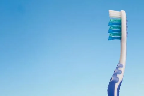 Toothbrush on blue background Stock Photos