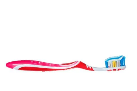 Toothbrush with blue two color toothpaste on light Stock Photos