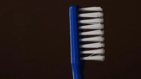 Toothbrush bristles on a brown background Stock Footage 146817536