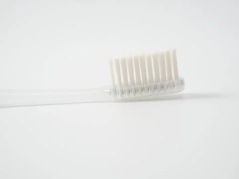 Toothbrush with copy space on white background. Stock Photos