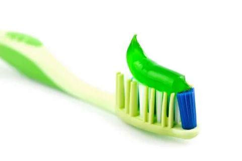 Toothbrush with green toothpaste isolated Stock Photos