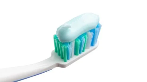 Toothbrush head with toothpaste, close-up view, isolated on white background, Stock Photos