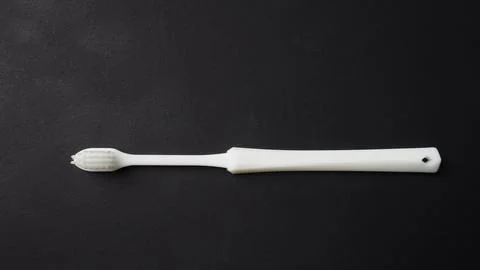 Toothbrush is isolated on black background Stock Photos