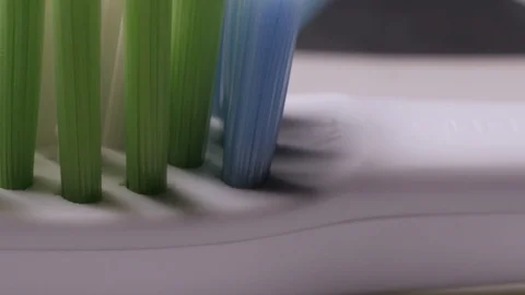 Toothbrush in macro, smooth camera movement Stock Footage 104053869