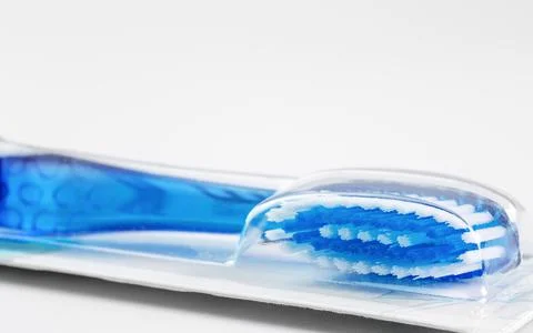 Toothbrush in package on white background Stock Photos