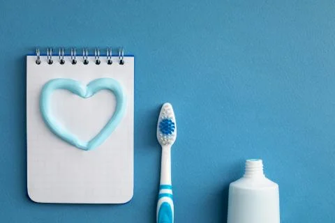 Toothbrush with paste and a notebook Stock Photos