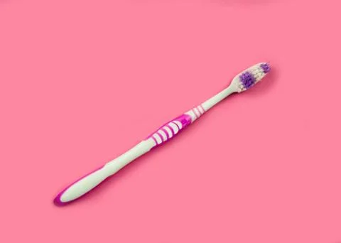 Toothbrush on a pink background. Stock Photos