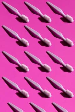 Toothbrush on the pink background seamless pattern. Trendy stylish health care Stock Photos