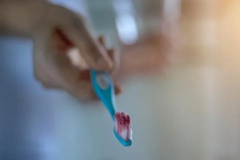 Toothbrush with scurvy in a bubble toothpaste on the bathroom background 스톡 사진