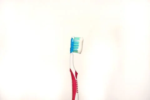 Toothbrush with smeared paste. Toothbrush with paste isolated on a white back Stock Photos