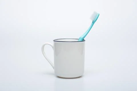 Toothbrush, toothpaste and cup Foto stock