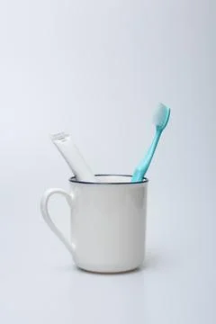 Toothbrush, toothpaste and cup Stock Photos