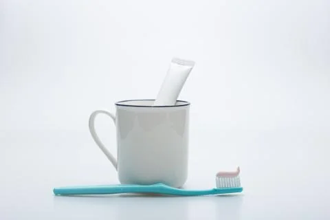 Toothbrush, toothpaste and cup Stock Photos