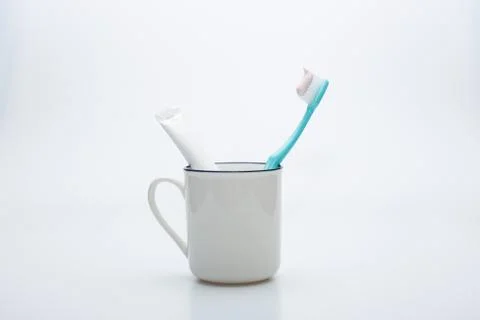Toothbrush, toothpaste and cup Stock Photos