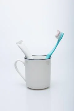 Toothbrush, toothpaste and cup Stock Photos