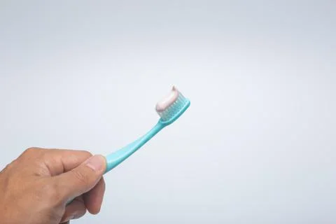 Toothbrush, toothpaste and cup Stock Photos