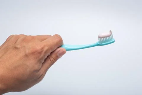 Toothbrush, toothpaste and cup Foto stock