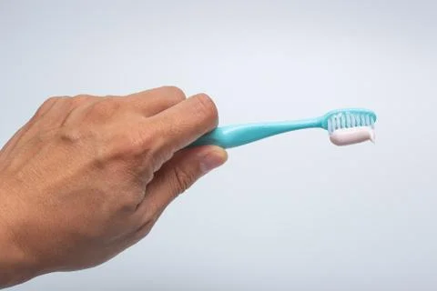 Toothbrush, toothpaste and cup Stock Photos