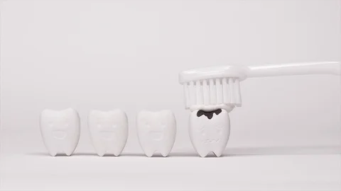 Toothbrush with Toothpaste brushing on Decayed Teeth model Stock Footage 103355054