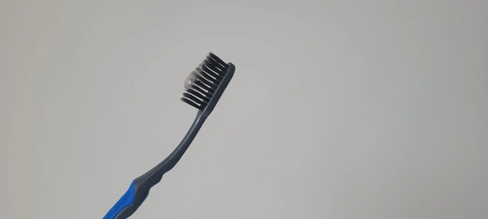 Toothbrush with toothpaste captured in a clean macro composition. Ideal vis.. Fotos Stock